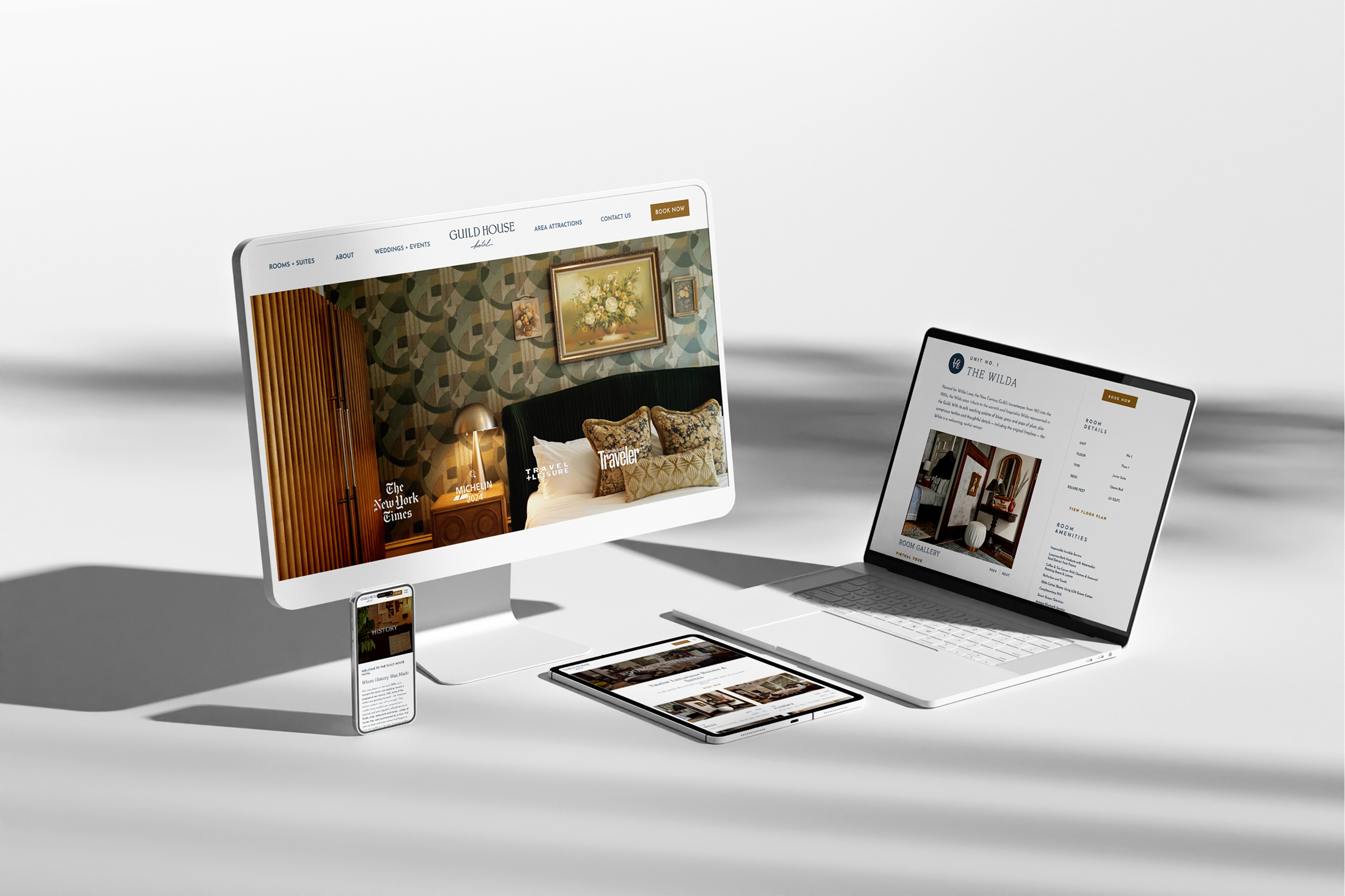 GHH-Screens A desktop, laptop, tablet, and smartphone display the Guild House Hotel's website. The design is sleek and modern, conveying luxury and elegance.