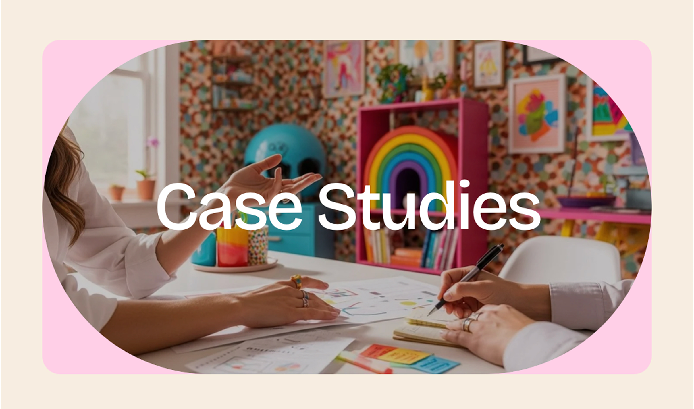 EricaMinutella-CaseStudies Two people collaborate at a colorful desk with papers and notes. A vibrant room with rainbow decor and patterns creates a creative, lively atmosphere. The words "Case Studies" appear over the image.