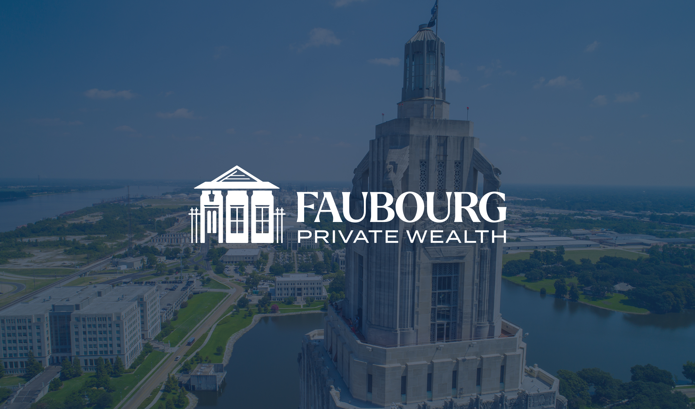 Faubourg-Hero Aerial view of a tall, stately building by a river on a sunny day, with "Faubourg Private Wealth" logo overlayed. The scene suggests stability and grandeur.