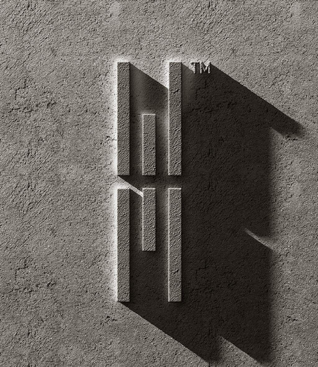 Embossed geometric logo with vertical bars on textured stone surface, casting long diagonal shadows. Modern, minimalist, and industrial tone.