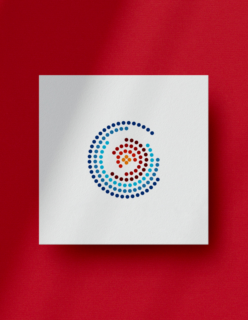 A dotted spiral design with blue and red hues is centered on a white square, placed on a vibrant red background. The image is visually striking and dynamic.