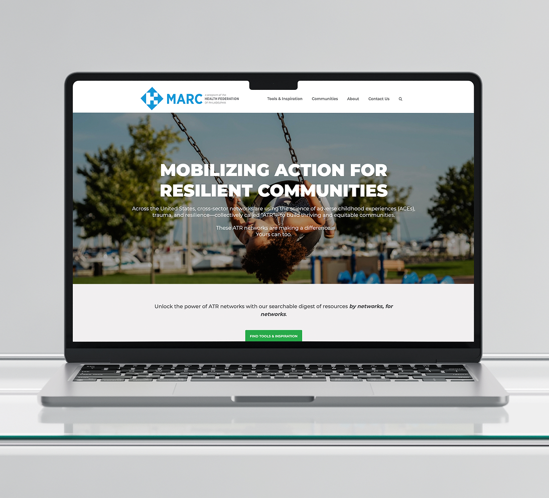 HealthFed-MARCHomepage A laptop displaying a website with "Mobilizing Action for Resilient Communities" text over an outdoor background. The tone is empowering and community-focused.