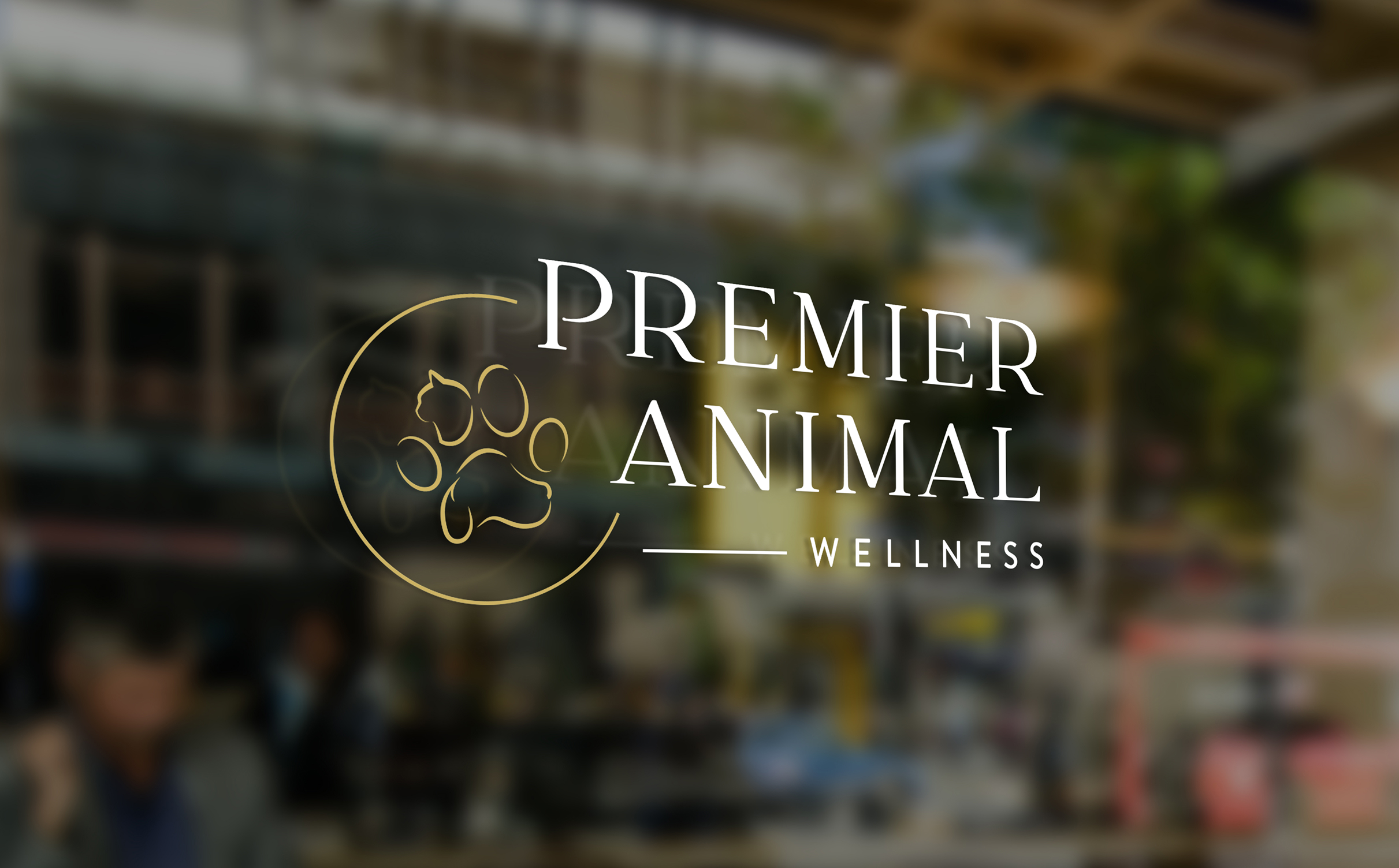 Logo for Premier Animal Wellness on glass window, featuring a gold paw print and elegant text. Background shows a blurred urban setting, conveying sophistication.