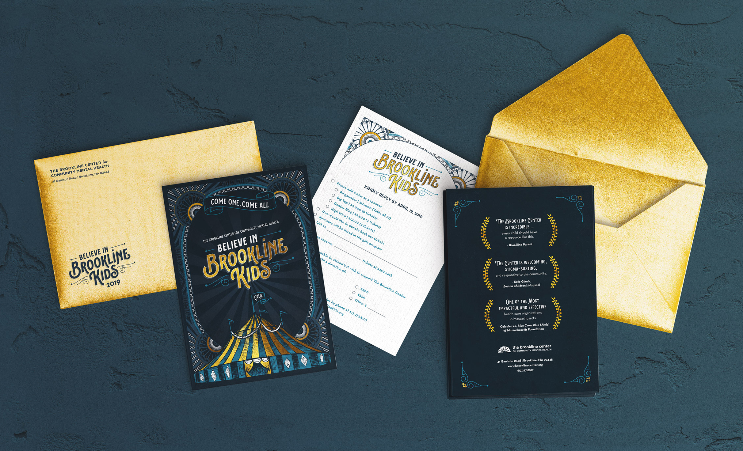 Invitation suite for The Brookline Center's Believe in Brookline Kids gala featuring 2 gold envelopes, dark blue invitation pages, and a white RSVP card. Each features gold elegant circus-themed elements.