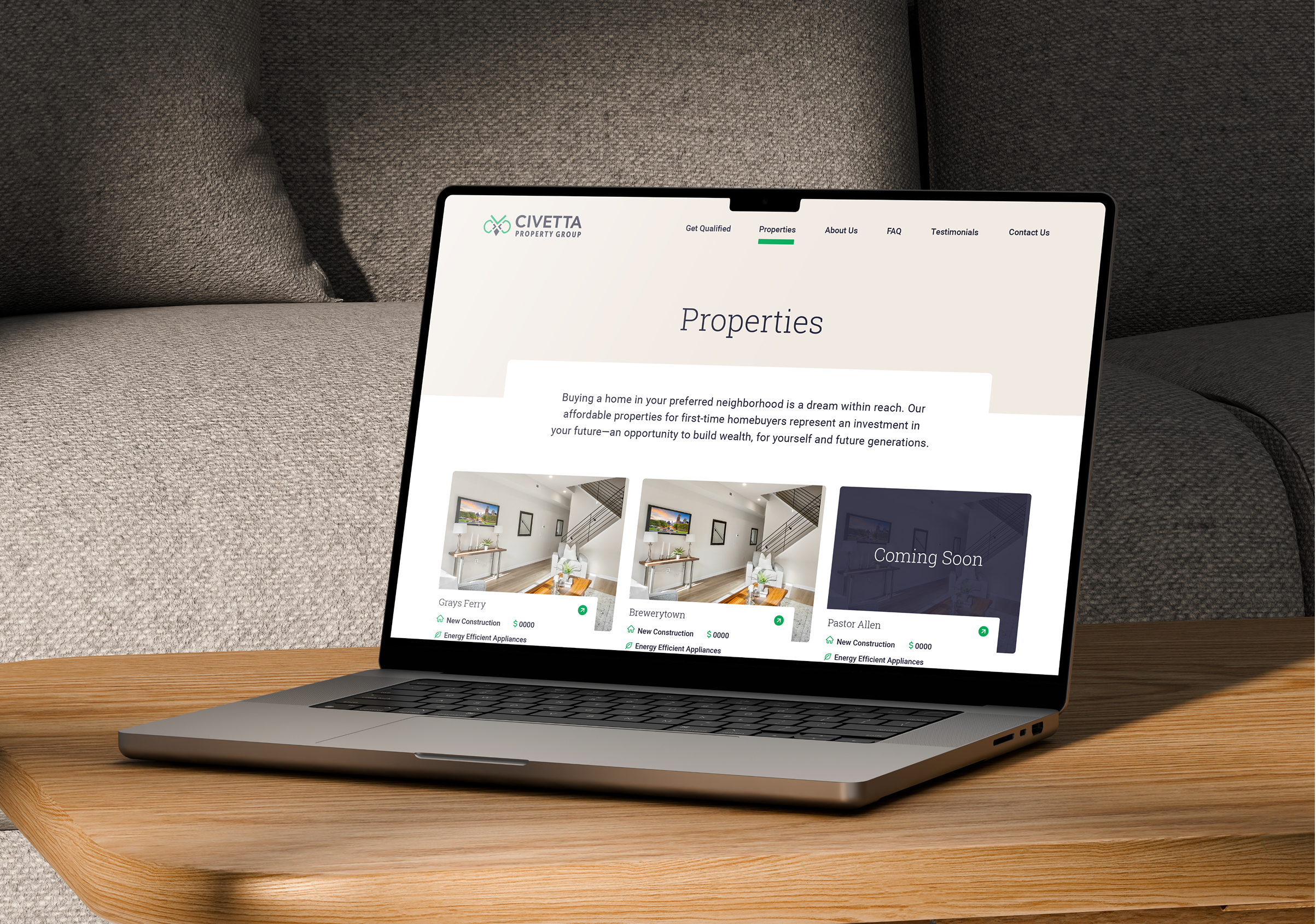 Civetta-Properties A laptop on a wooden table shows a page from the Civetta Property Group" website with property listings.