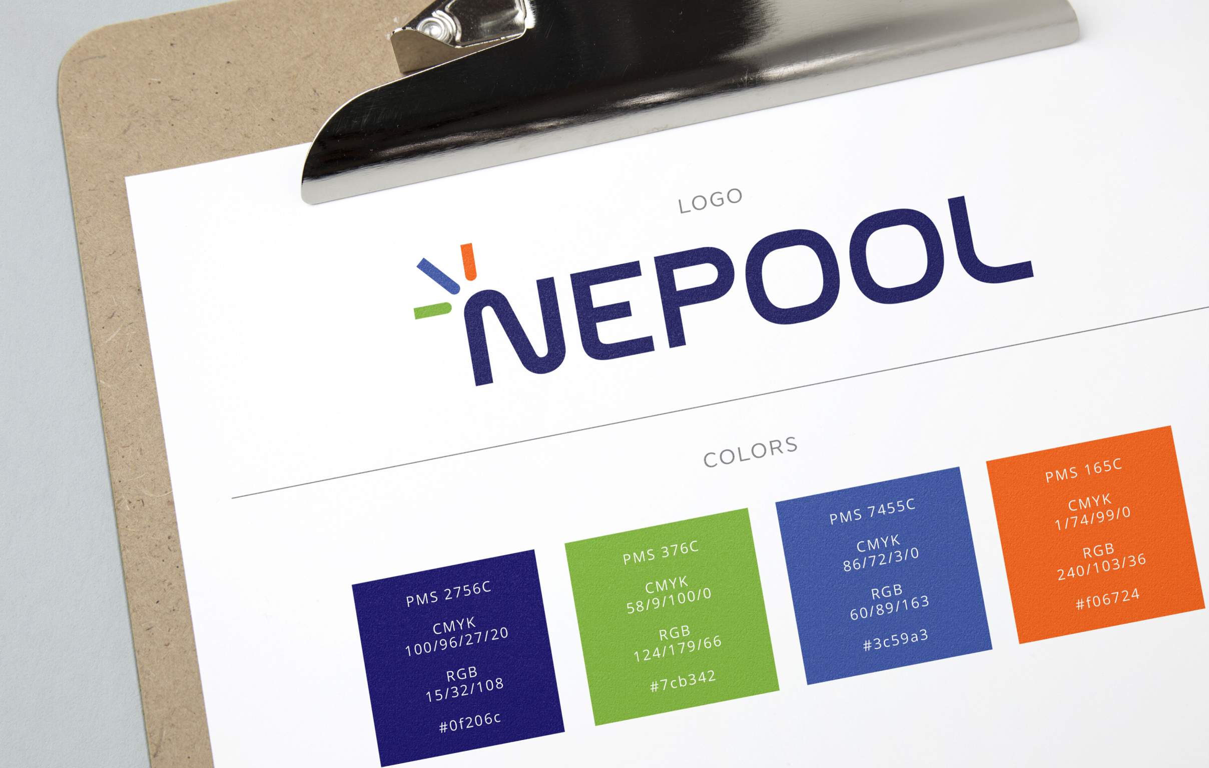 The image shows a clipboard with a paper displaying a colorful logo. The logo reads "NEPOOL" with green, blue, and orange lines in the top left corner of the "N." Color swatches in navy, green, blue, and orange are underneath.