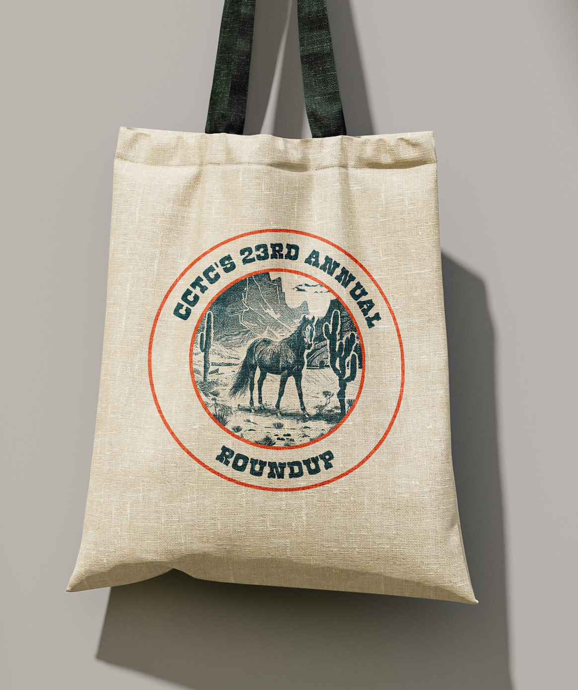 Roundup-Tote Beige tote bag with "CCTC's 23rd Annual Roundup" text encircling a vintage horse and cactus scene.