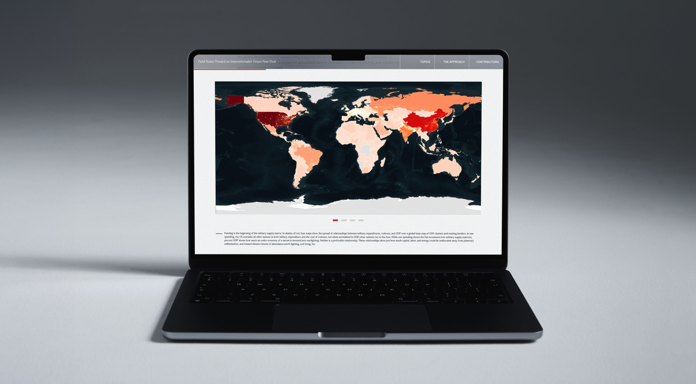 Laptop displaying a page from the Field Notes Toward an Internationalist Green New Deal website featuring a world map with countries shaded in red tones, indicating various data metrics.